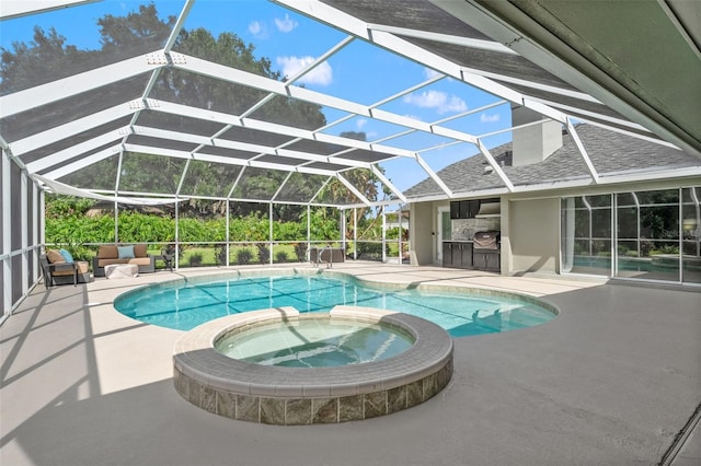 17311 Carriage Way, Odessa, FL 33556 - view of swimming pool with a patio, a pool with connected hot tub, glass enclosure, and area for grilling
