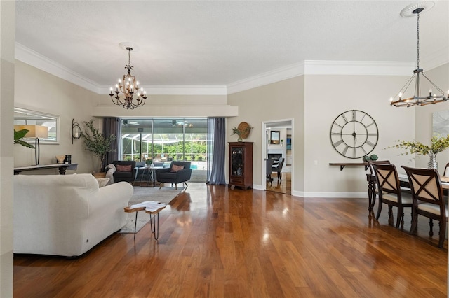 17311 Carriage Way, Odessa, FL 33556 - living area with a chandelier, ornamental molding, and wood finished floors