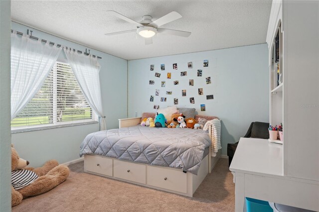 17311 Carriage Way, Odessa, FL 33556 - bedroom with light carpet, a textured ceiling, and ceiling fan