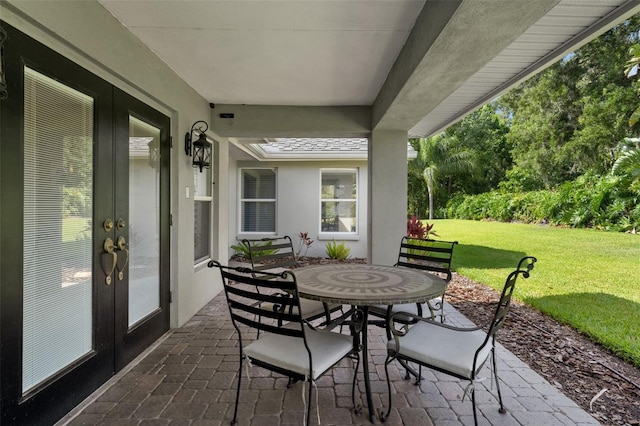 17311 Carriage Way, Odessa, FL 33556 - view of patio / terrace with french doors and outdoor dining area