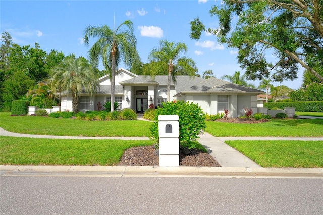 17311 Carriage Way, Odessa, FL 33556 - single story home with stucco siding and a front yard