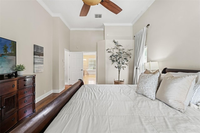 17311 Carriage Way, Odessa, FL 33556 - bedroom with ornamental molding, wood finished floors, multiple windows, connected bathroom, and ceiling fan