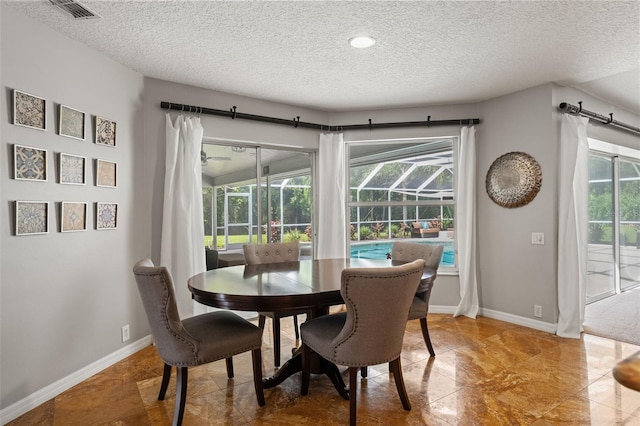 17311 Carriage Way, Odessa, FL 33556 - dining area featuring a textured ceiling and recessed lighting