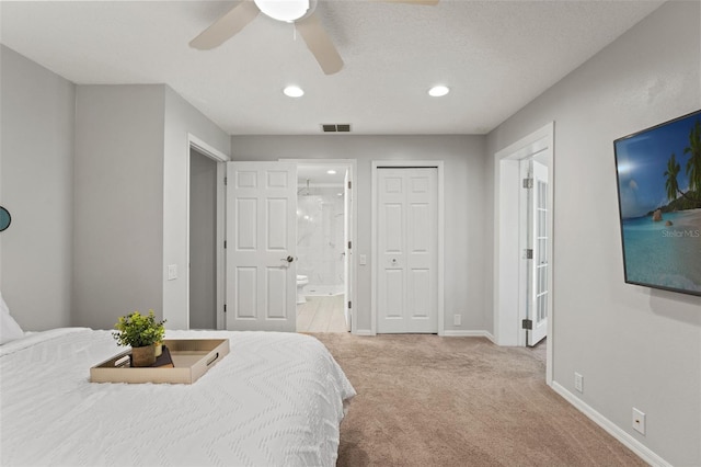 17311 Carriage Way, Odessa, FL 33556 - bedroom with light colored carpet, recessed lighting, ensuite bath, a ceiling fan, and a closet