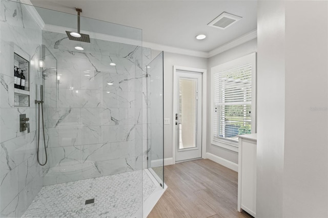 17311 Carriage Way, Odessa, FL 33556 - bathroom featuring ornamental molding, a marble finish shower, and wood finished floors