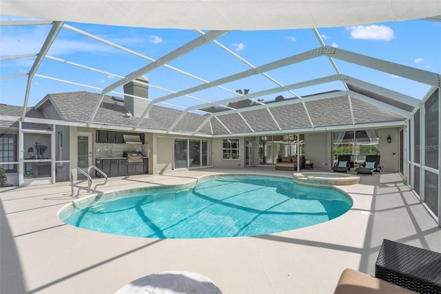 17311 Carriage Way, Odessa, FL 33556 - view of pool with area for grilling, a patio, glass enclosure, and a pool with connected hot tub