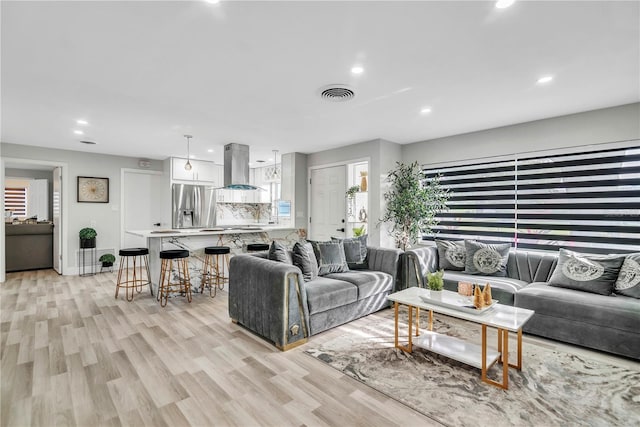 1384 S Hillcrest Ave, Clearwater, FL 33756 - living room with recessed lighting and light wood finished floors
