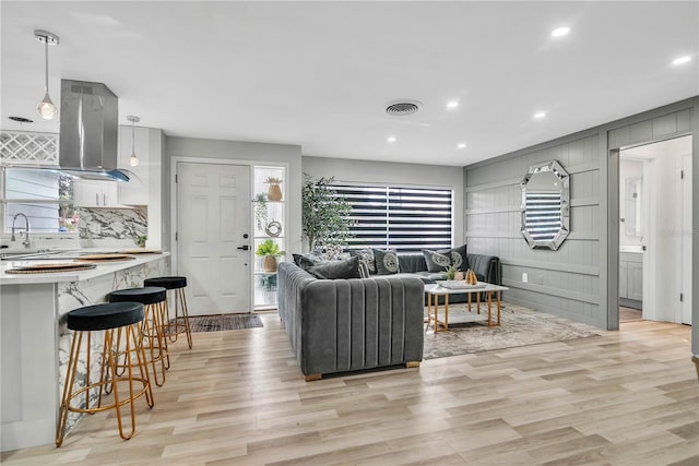1384 S Hillcrest Ave, Clearwater, FL 33756 - living area featuring light wood-style flooring and recessed lighting