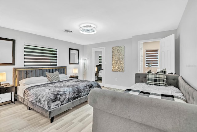 1384 S Hillcrest Ave, Clearwater, FL 33756 - bedroom with light wood-type flooring and baseboards