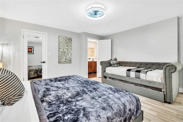 1384 S Hillcrest Ave, Clearwater, FL 33756 - bedroom featuring light wood-type flooring and ensuite bath