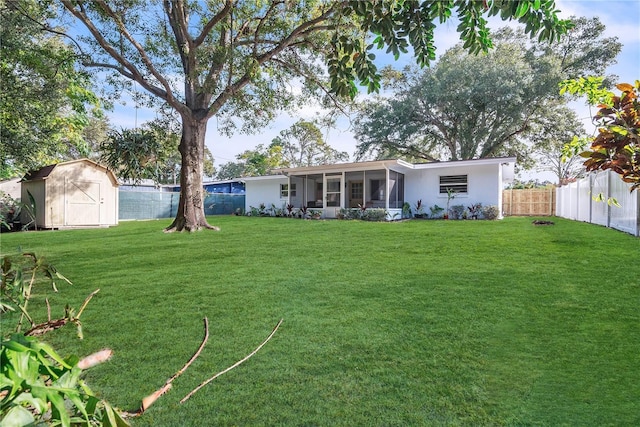 1384 S Hillcrest Ave, Clearwater, FL 33756 - rear view of house featuring a storage unit, a sunroom, and a fenced backyard