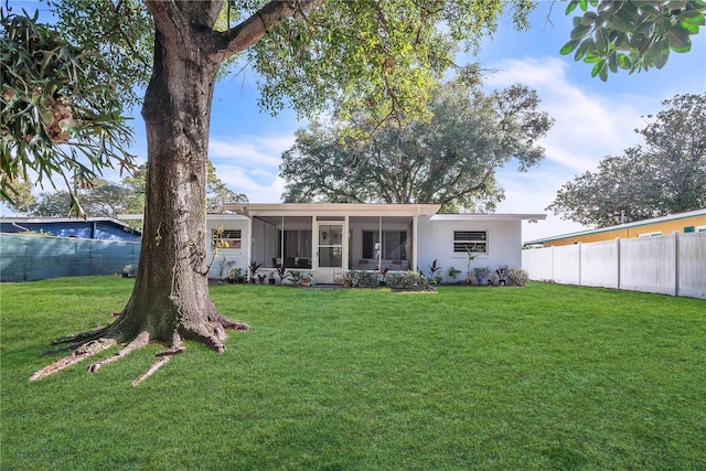 1384 S Hillcrest Ave, Clearwater, FL 33756 - rear view of property with a sunroom
