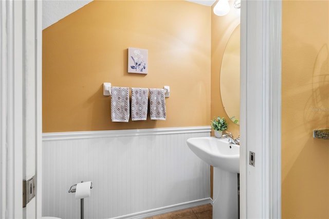 6677 84th Ave N, Pinellas Park, FL 33781 - bathroom with a wainscoted wall and tile patterned flooring