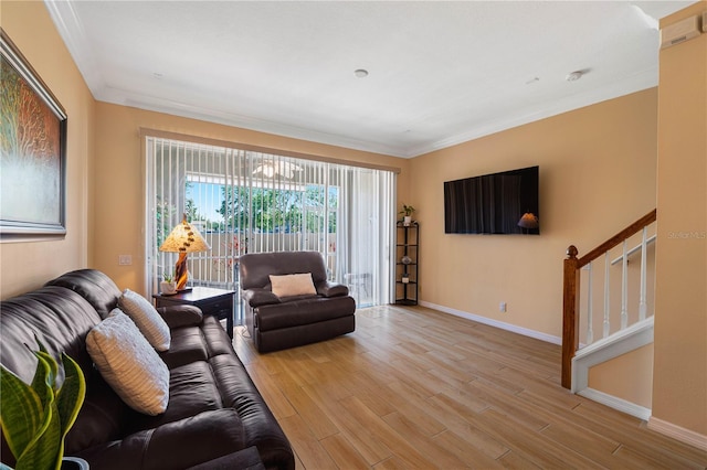 6677 84th Ave N, Pinellas Park, FL 33781 - living area featuring light wood-style floors, stairway, crown molding, and a chandelier