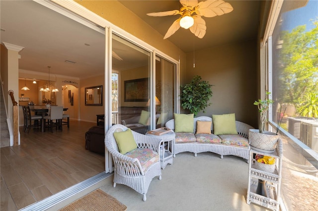 6677 84th Ave N, Pinellas Park, FL 33781 - sunroom featuring ceiling fan and a chandelier