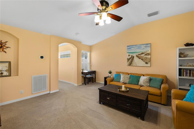 6677 84th Ave N, Pinellas Park, FL 33781 - living room with arched walkways, lofted ceiling, a ceiling fan, and carpet flooring