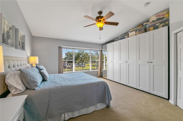 6677 84th Ave N, Pinellas Park, FL 33781 - bedroom featuring vaulted ceiling, light colored carpet, and a ceiling fan