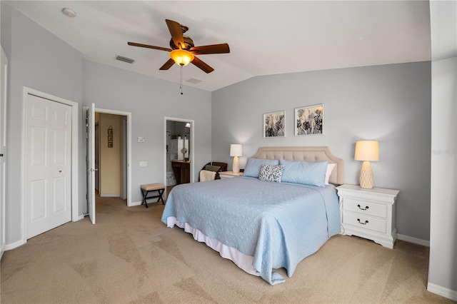 6677 84th Ave N, Pinellas Park, FL 33781 - bedroom with light colored carpet, lofted ceiling, ceiling fan, and connected bathroom