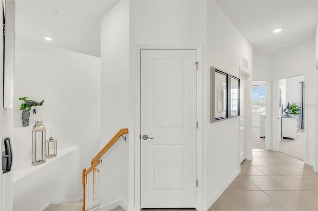 43250 Water Bird Way Unit 5921, Punta Gorda, FL 33982 - hallway with an upstairs landing, light tile patterned floors, and recessed lighting