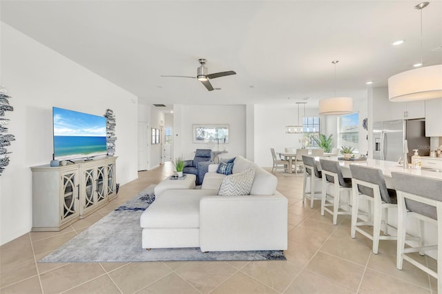 43250 Water Bird Way Unit 5921, Punta Gorda, FL 33982 - living room with light tile patterned floors, healthy amount of natural light, a ceiling fan, and recessed lighting