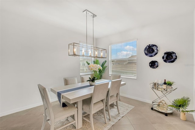 43250 Water Bird Way Unit 5921, Punta Gorda, FL 33982 - dining space with light tile patterned flooring and a chandelier