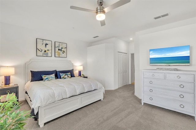 43250 Water Bird Way Unit 5921, Punta Gorda, FL 33982 - bedroom featuring light colored carpet, a ceiling fan, and a closet