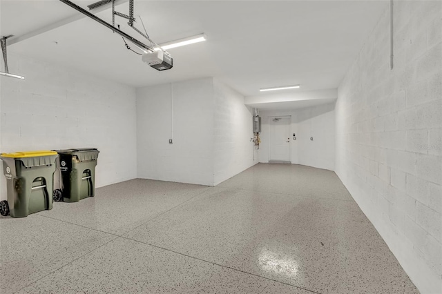 43250 Water Bird Way Unit 5921, Punta Gorda, FL 33982 - garage featuring a garage door opener and concrete block wall