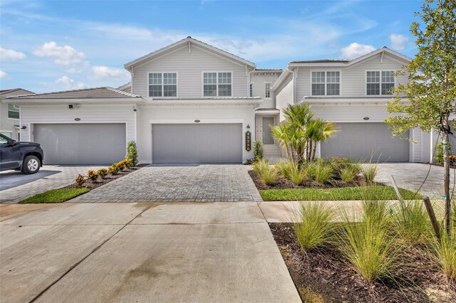 43250 Water Bird Way Unit 5921, Punta Gorda, FL 33982 - traditional-style home featuring driveway and an attached garage