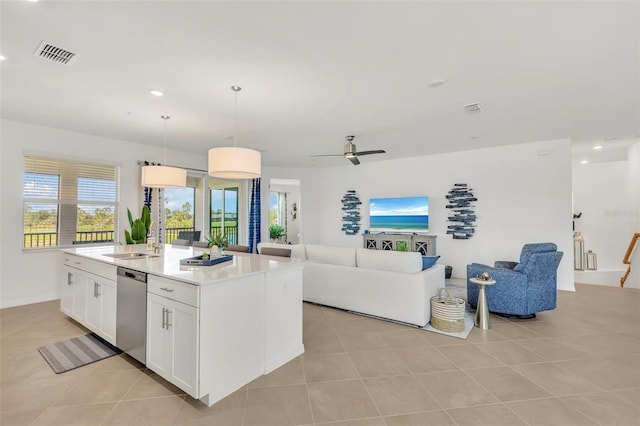 43250 Water Bird Way Unit 5921, Punta Gorda, FL 33982 - kitchen with open floor plan, dishwasher, light tile patterned floors, white cabinets, and recessed lighting