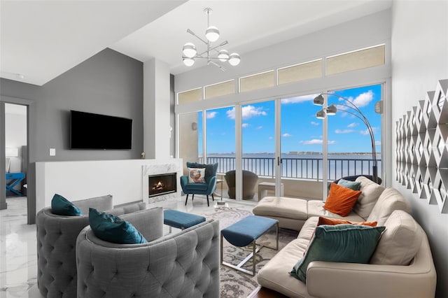 5153 Isla Key Blvd S Unit 415, Saint Petersburg, FL 33715 - living area with marble look tile flooring, a chandelier, a fireplace, and a high ceiling