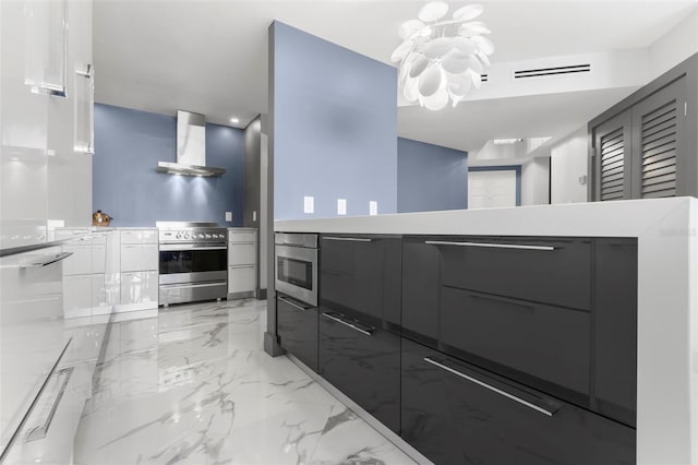 5153 Isla Key Blvd S Unit 415, Saint Petersburg, FL 33715 - kitchen with stainless steel range with electric cooktop, wall chimney range hood, and modern cabinets