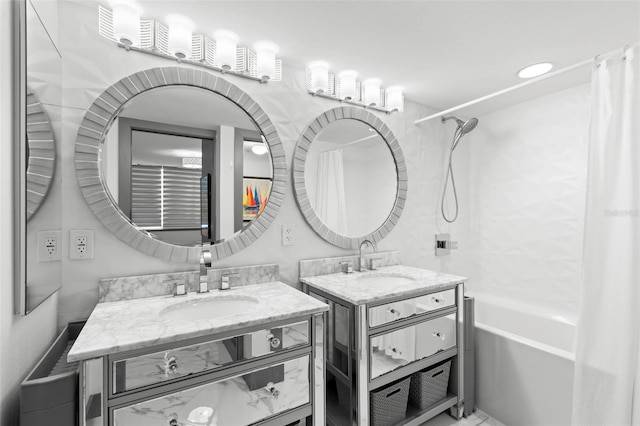 5153 Isla Key Blvd S Unit 415, Saint Petersburg, FL 33715 - full bathroom featuring two vanities and shower / tub combo