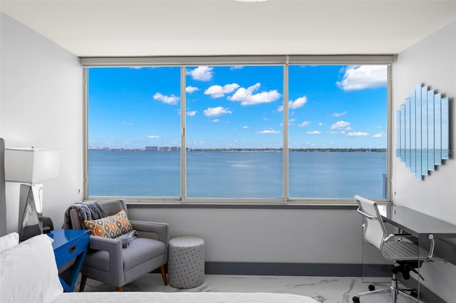 5153 Isla Key Blvd S Unit 415, Saint Petersburg, FL 33715 - bedroom with a water view, marble look tile flooring, multiple windows, a wall of windows, and a desk