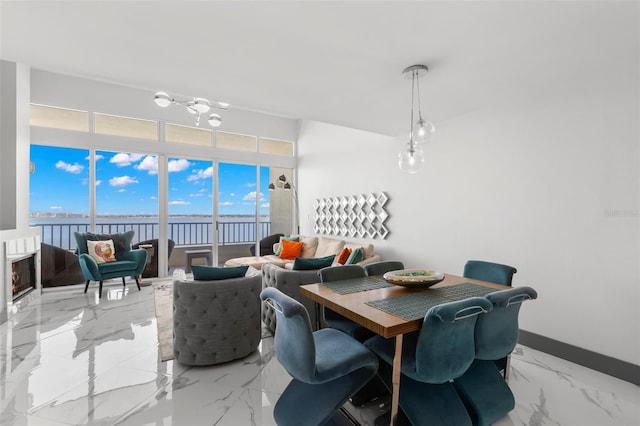 5153 Isla Key Blvd S Unit 415, Saint Petersburg, FL 33715 - dining room with a water view and marble finish flooring
