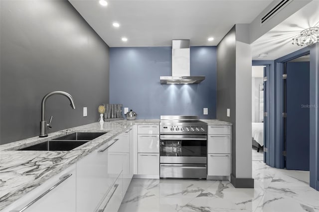 5153 Isla Key Blvd S Unit 415, Saint Petersburg, FL 33715 - kitchen featuring stainless steel electric range, wall chimney range hood, light stone counters, recessed lighting, and white cabinets