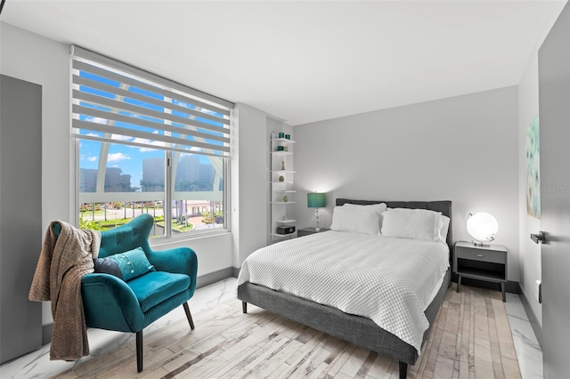 5153 Isla Key Blvd S Unit 415, Saint Petersburg, FL 33715 - bedroom featuring a view of city and light wood finished floors