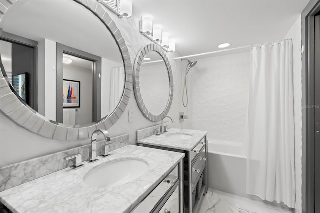 5153 Isla Key Blvd S Unit 415, Saint Petersburg, FL 33715 - full bathroom with two vanities, shower / tub combo with curtain, marble finish flooring, and recessed lighting