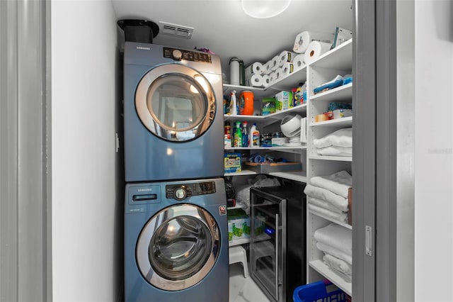 5153 Isla Key Blvd S Unit 415, Saint Petersburg, FL 33715 - laundry room with stacked washer and clothes dryer