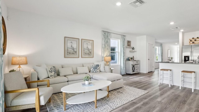 4319 Sand Dollar Way, Zephyrhills, FL 33541 - living area featuring wood finished floors and recessed lighting
