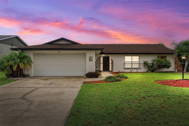 6521 Bimini Ct, Apollo Beach, FL 33572 - ranch-style home with stucco siding, concrete driveway, an attached garage, and a front lawn