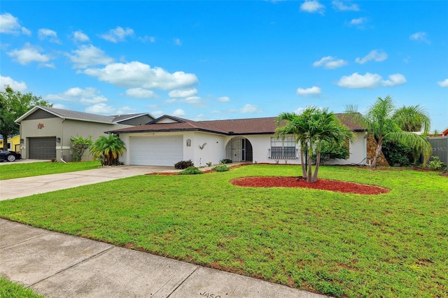 6521 Bimini Ct, Apollo Beach, FL 33572 - ranch-style home with a garage, stucco siding, concrete driveway, and a front yard