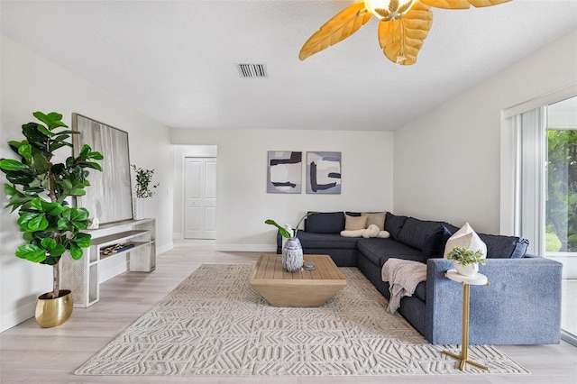 6521 Bimini Ct, Apollo Beach, FL 33572 - living room with plenty of natural light, light wood-style floors, and ceiling fan
