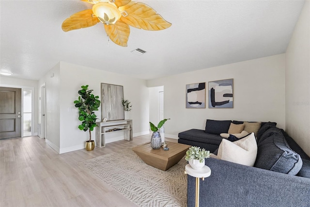 6521 Bimini Ct, Apollo Beach, FL 33572 - living room featuring light wood finished floors and a ceiling fan
