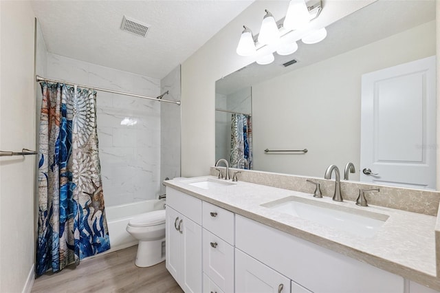 6521 Bimini Ct, Apollo Beach, FL 33572 - full bathroom featuring double vanity, wood finished floors, and shower / bath combination with curtain
