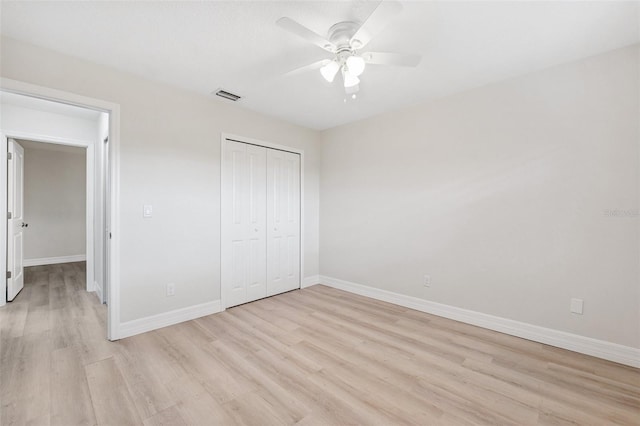 6521 Bimini Ct, Apollo Beach, FL 33572 - unfurnished bedroom with light wood-style flooring, a closet, and ceiling fan
