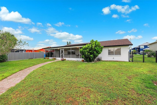 6521 Bimini Ct, Apollo Beach, FL 33572 - back of house featuring a sunroom, a fenced backyard, and stucco siding