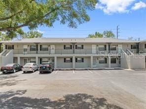 101 Lake Ave NE Unit 121, Largo, FL 33771 - view of property featuring uncovered parking