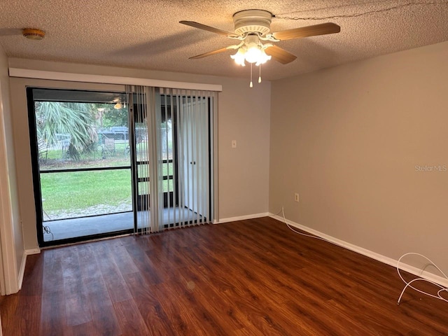 101 Lake Ave NE Unit 121, Largo, FL 33771 - empty room featuring a ceiling fan, dark wood-style flooring, a smoke detector, and a textured ceiling