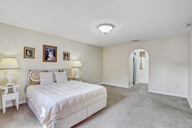 10437 River Bream Dr, Riverview, FL 33569 - carpeted bedroom with arched walkways and a textured ceiling