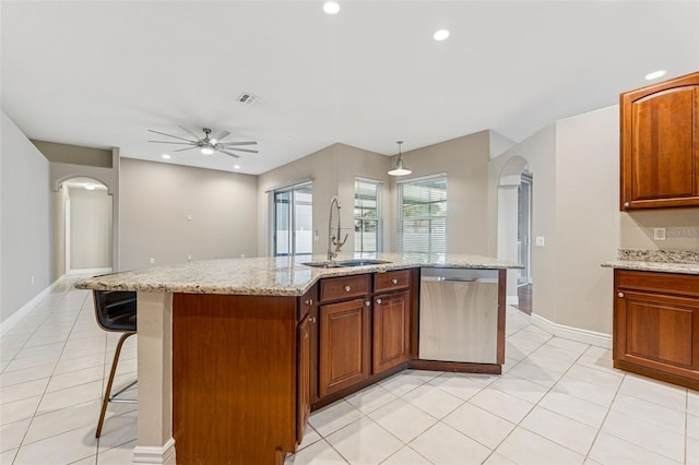 25946 Buckthorn Ave, Land O Lakes, FL 34639 - kitchen featuring arched walkways, stainless steel dishwasher, ceiling fan, light tile patterned flooring, and recessed lighting